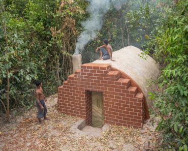 Build complete and warm survival shelter Bushcraft earth hut, fireplace